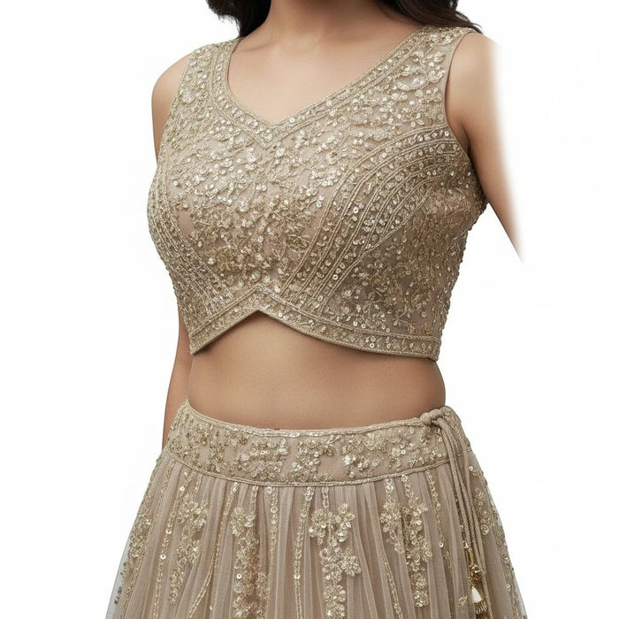 Kurti Connection USA champagne sleeveless crop top and skirt set with intricate floral embroidery and beadwork