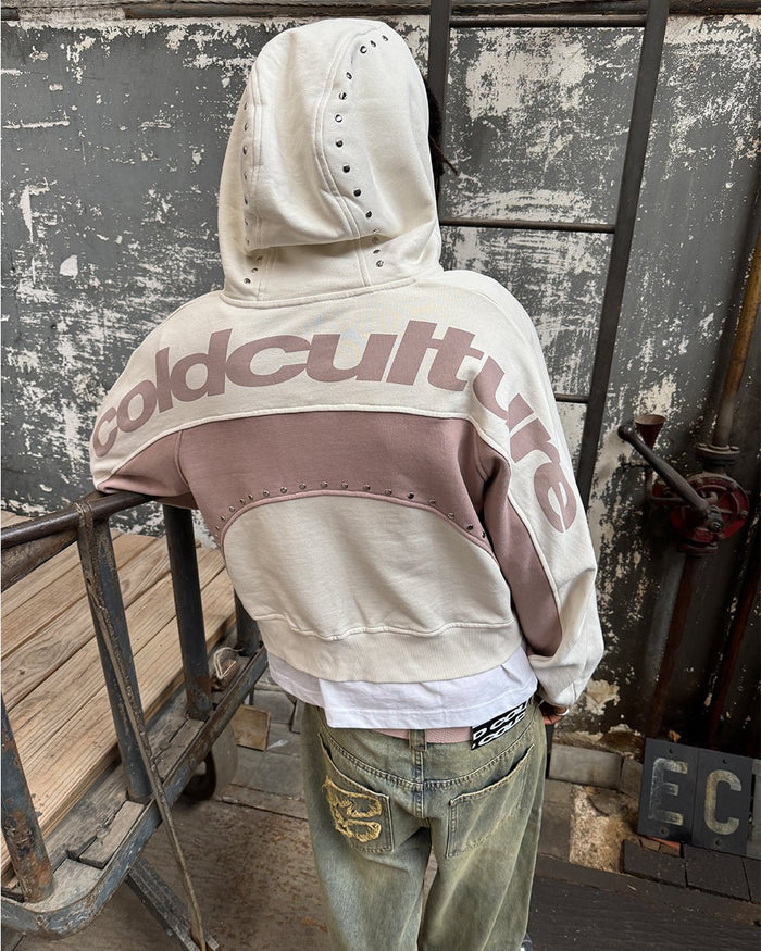 STUD ZIP HOODIE LIGHT GREY - cream and pink studded zip-up hoodie, street style shot - Cold Culture