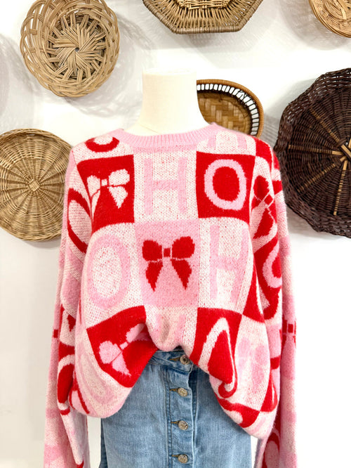 The “Ho Ho Ho” & Bow Sweater in Pink & Red