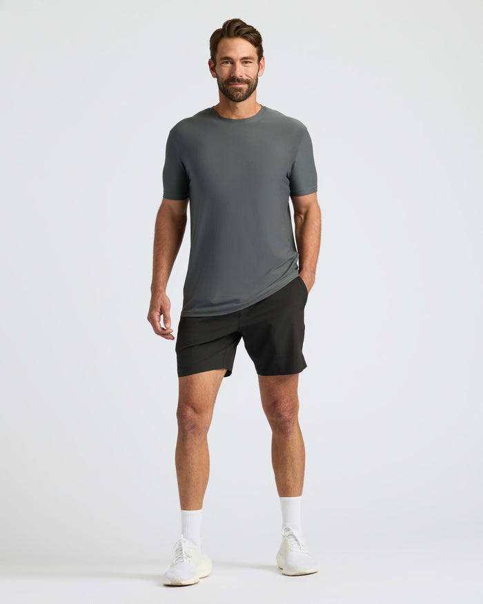 Man wearing Classic Polo with athletic shorts and running shoes.