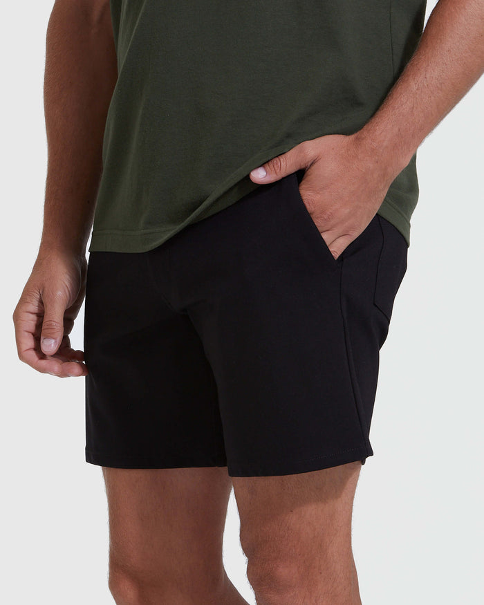 Man wearing Black Commuter Short with hand in pocket.
