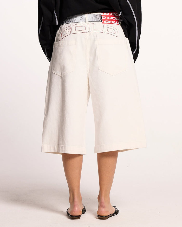 COWBOY SHORTS WHITE - white denim shorts, back view on female model - Cold Culture #woman