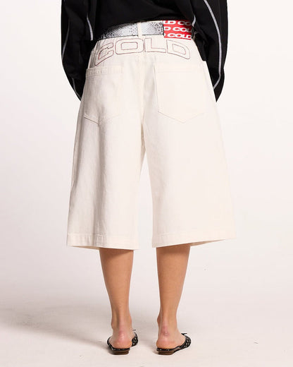 COWBOY SHORTS WHITE - white denim shorts, back view on female model - Cold Culture #woman