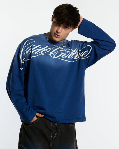 CROSSED SCRIPT LONGSLEEVE VIBRANT BLUE - washed blue script print longsleeve tee, front view on male model - Cold Culture #man