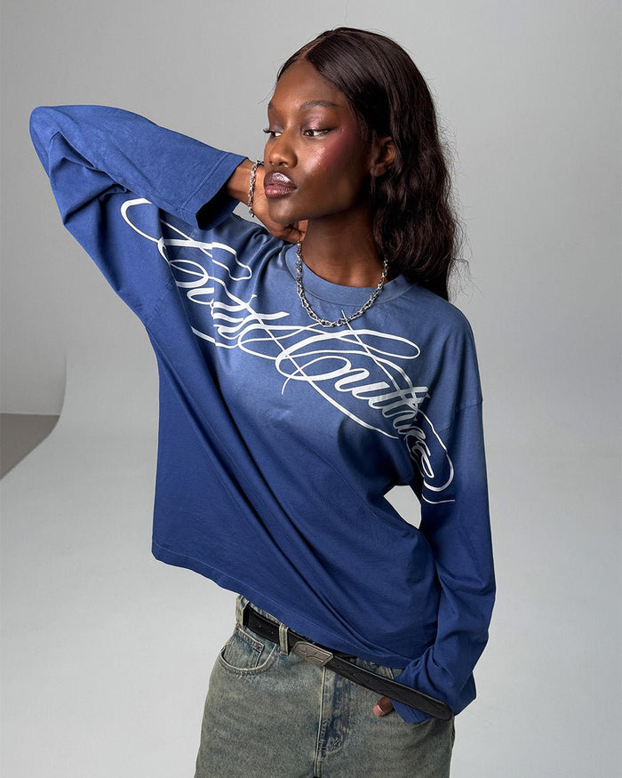 CROSSED SCRIPT LONGSLEEVE VIBRANT BLUE - washed blue script print longsleeve tee, front view on female model - Cold Culture