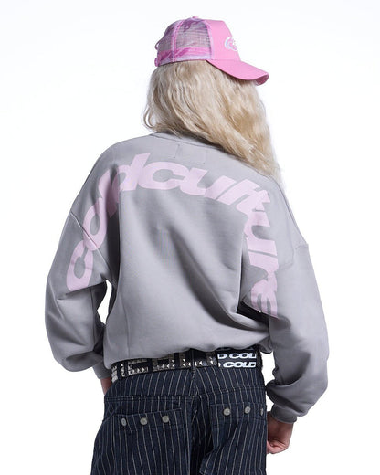 CURVED CREWNECK GREY - grey oversized crewneck sweatshirt, back view on female model - Cold Culture #woman