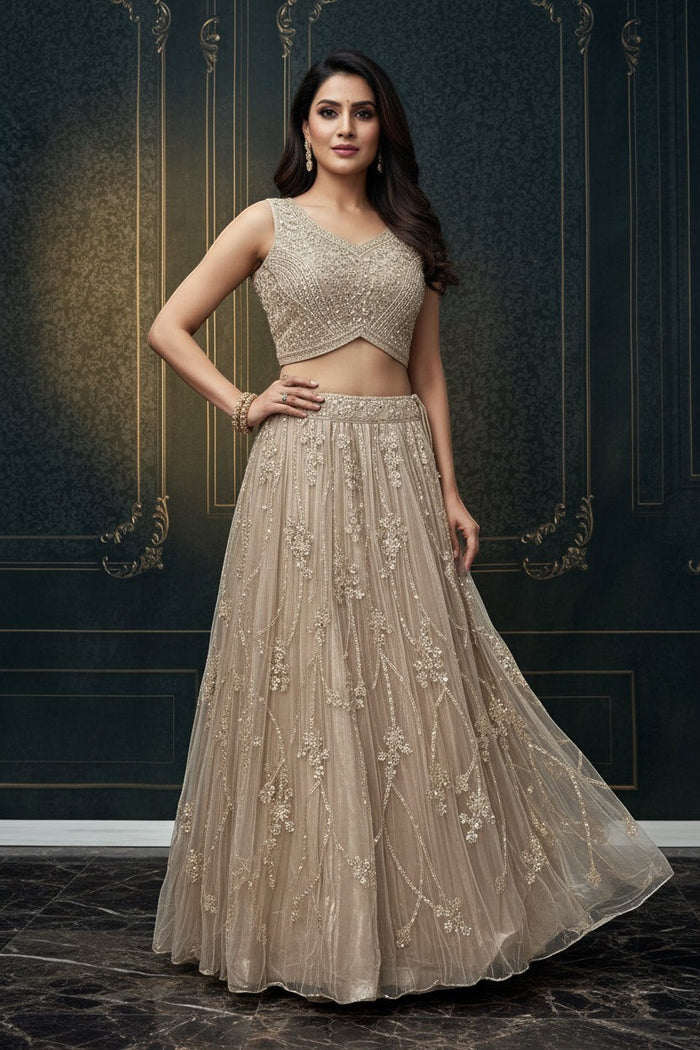 Kurti Connection USA champagne embellished sleeveless crop top and floor-length skirt set with intricate embroidery