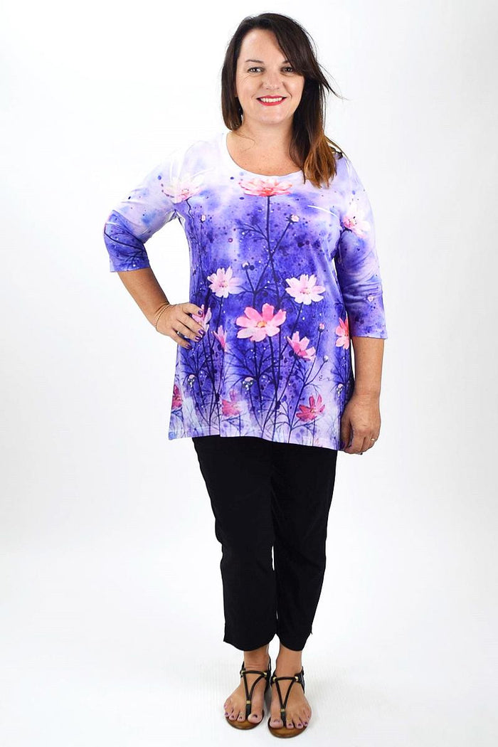 Fanny Lam Flowers in May Tunic with vibrant floral print, lightweight fabric, and relaxed fit, displayed on a hanger.