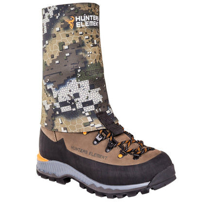 A camopuflage neoprene gaiter with a logo, designed to cover the lower leg and footwear, attached to a brown boot with hooks.