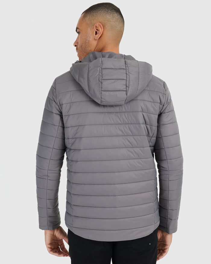 Gunmetal Hooded Puffer Jacket with quilted design and attached hood.