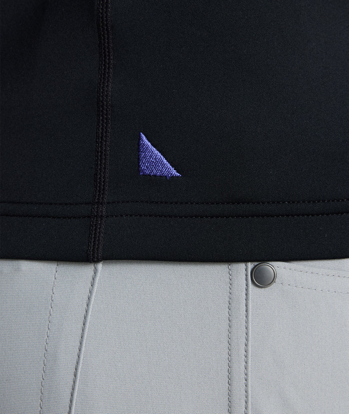 Model wearing a  Performance Quarter-Zip in black.