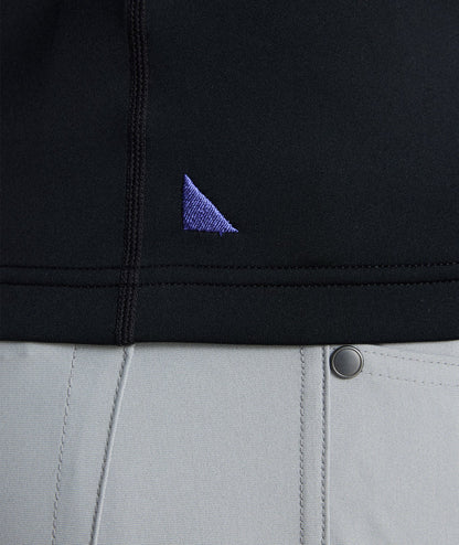 Model wearing a  Performance Quarter-Zip in black.