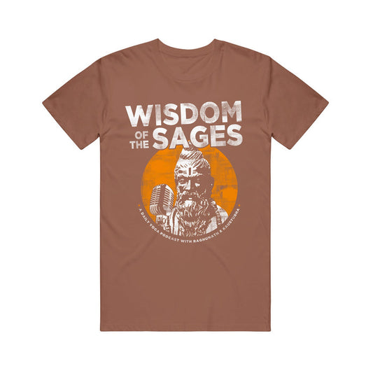 Wisdom of the Sages brown t-shirt displays “WISDOM OF THE SAGES” above an illustrated bearded sage with a mic, set on an orange circle. Below, it reads: “A yoga podcast with Raghunath & Kaustubha.”.