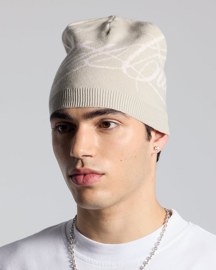 SCRIPT BEANIE BEIGE - beige script knit beanie, on model close-up - Cold Culture #man
