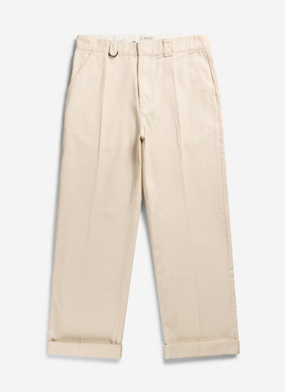 A pair of Percival Stay Press Trousers in ecru cotton twill, laid flat with rolled up cuffs.
