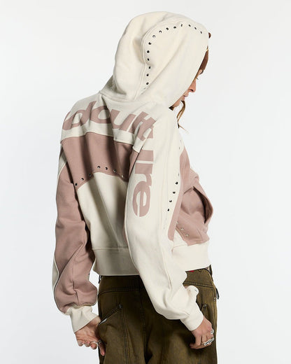 STUD ZIP HOODIE LIGHT GREY - cream and pink studded zip-up hoodie, back view on female model - Cold Culture #woman