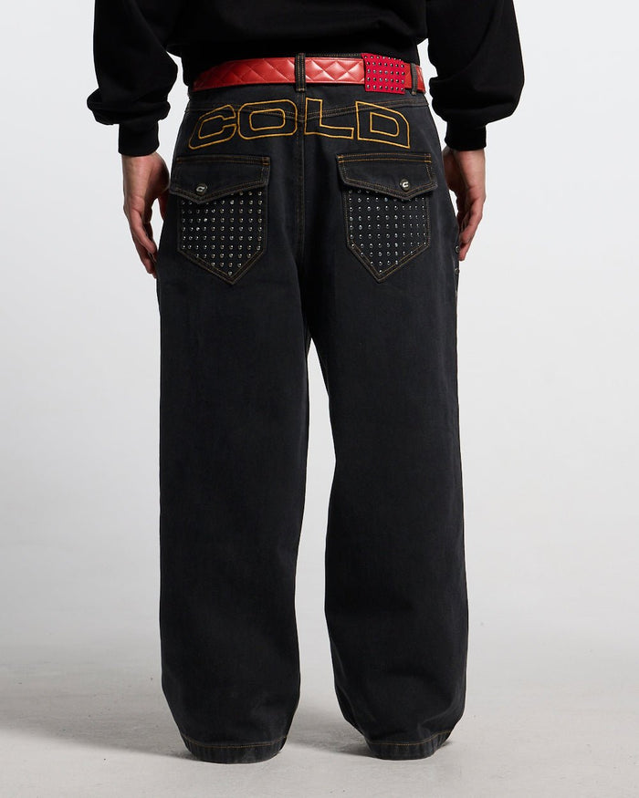 STUDS PANTS BLACK DENIM - black studded denim pants, back view on male model - Cold Culture #man