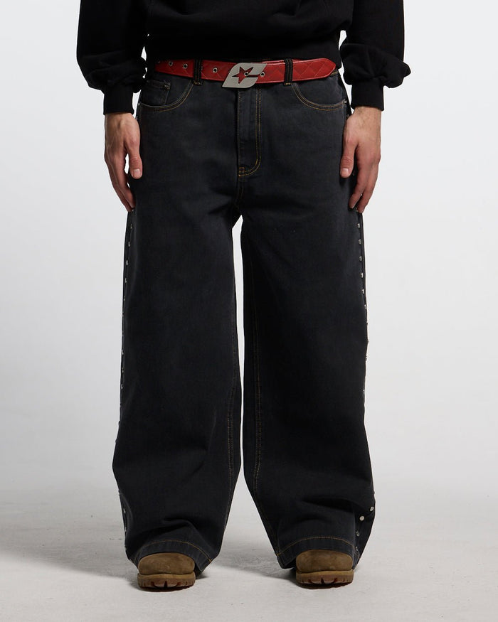 STUDS PANTS BLACK DENIM - black studded denim pants, front view on male model - Cold Culture #man