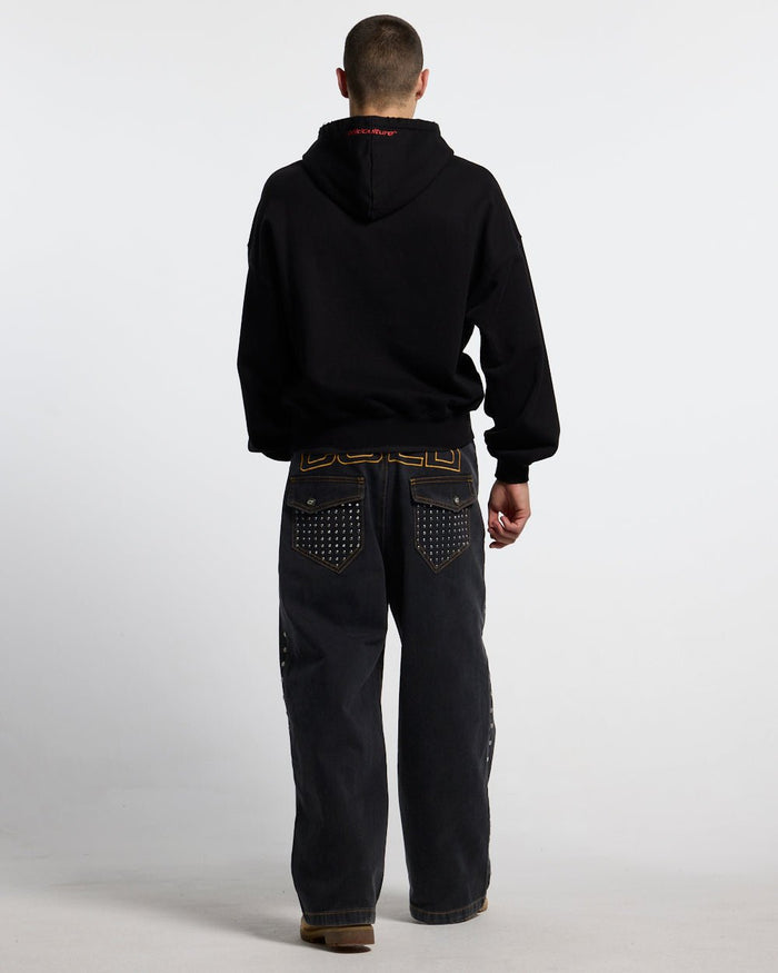 STUDS PANTS BLACK DENIM - black studded denim pants, back view on male model - Cold Culture #man