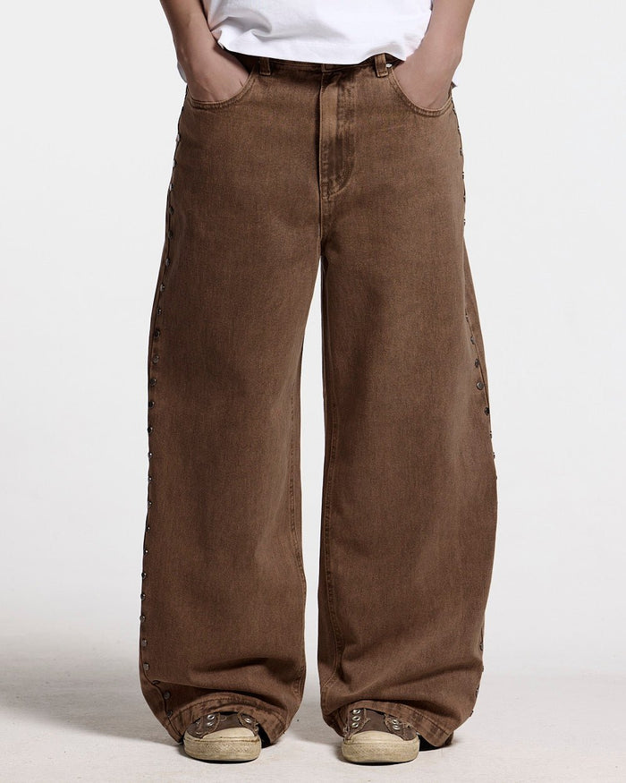 STUDS PANTS BROWN DENIM - brown studded denim pants, front view on female model - Cold Culture #woman