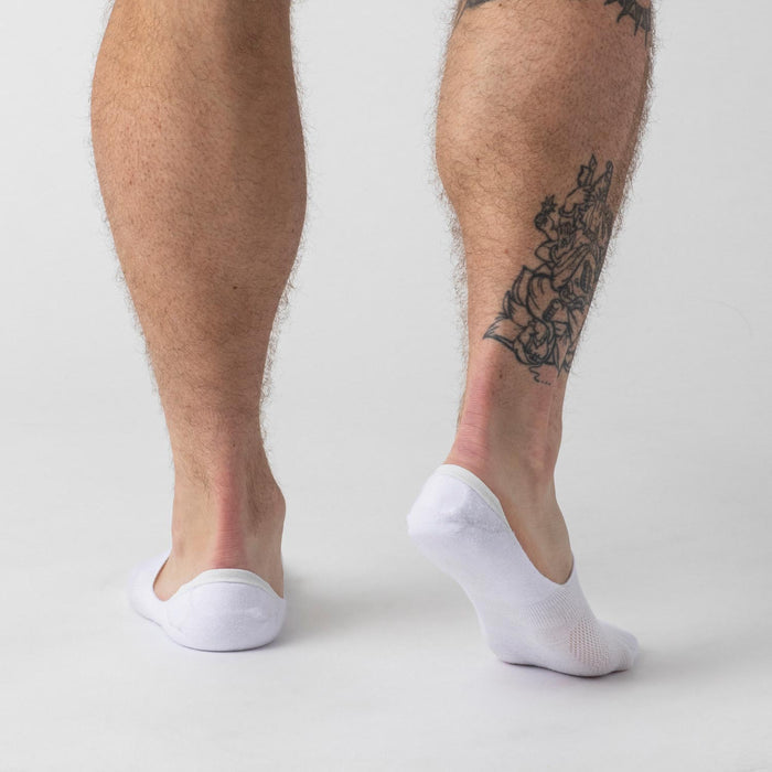 White Never Show Socks 3 Pack on feet with tattoo visible.