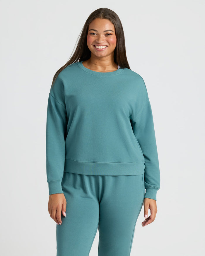 Young woman in Womens Stormcloud Slouch Pullover Crew & Relaxed Jogger Set. MODEL_INFO: Jade is 5'9", wearing a size L