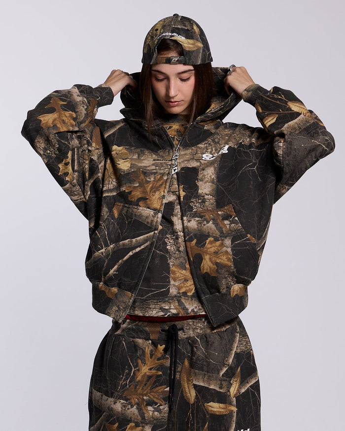 ZIP HOODIE REALTREE BLACK - black camo zip-up hoodie, front view on female model - Cold Culture #woman